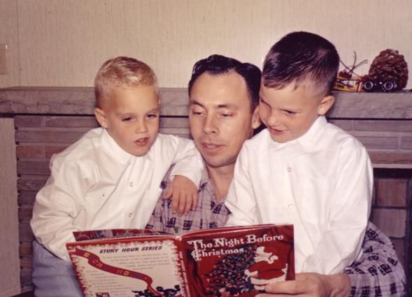 Chet Gilbert reading to sons Mike and Gordy.jpg